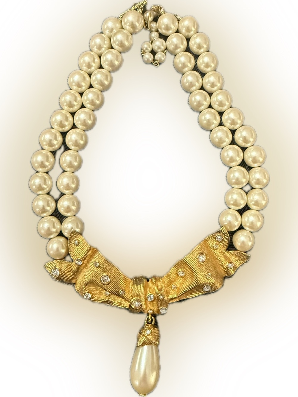 Triple-Strand Cream Pearl Necklace with Gold Bow and Teardrop Pendant
